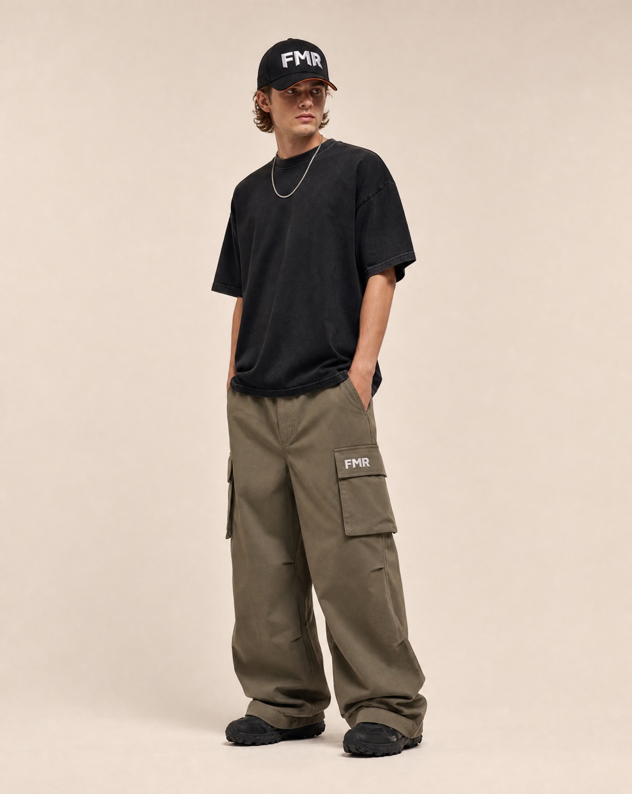 FMR tee, cargo pant and cap on a male model